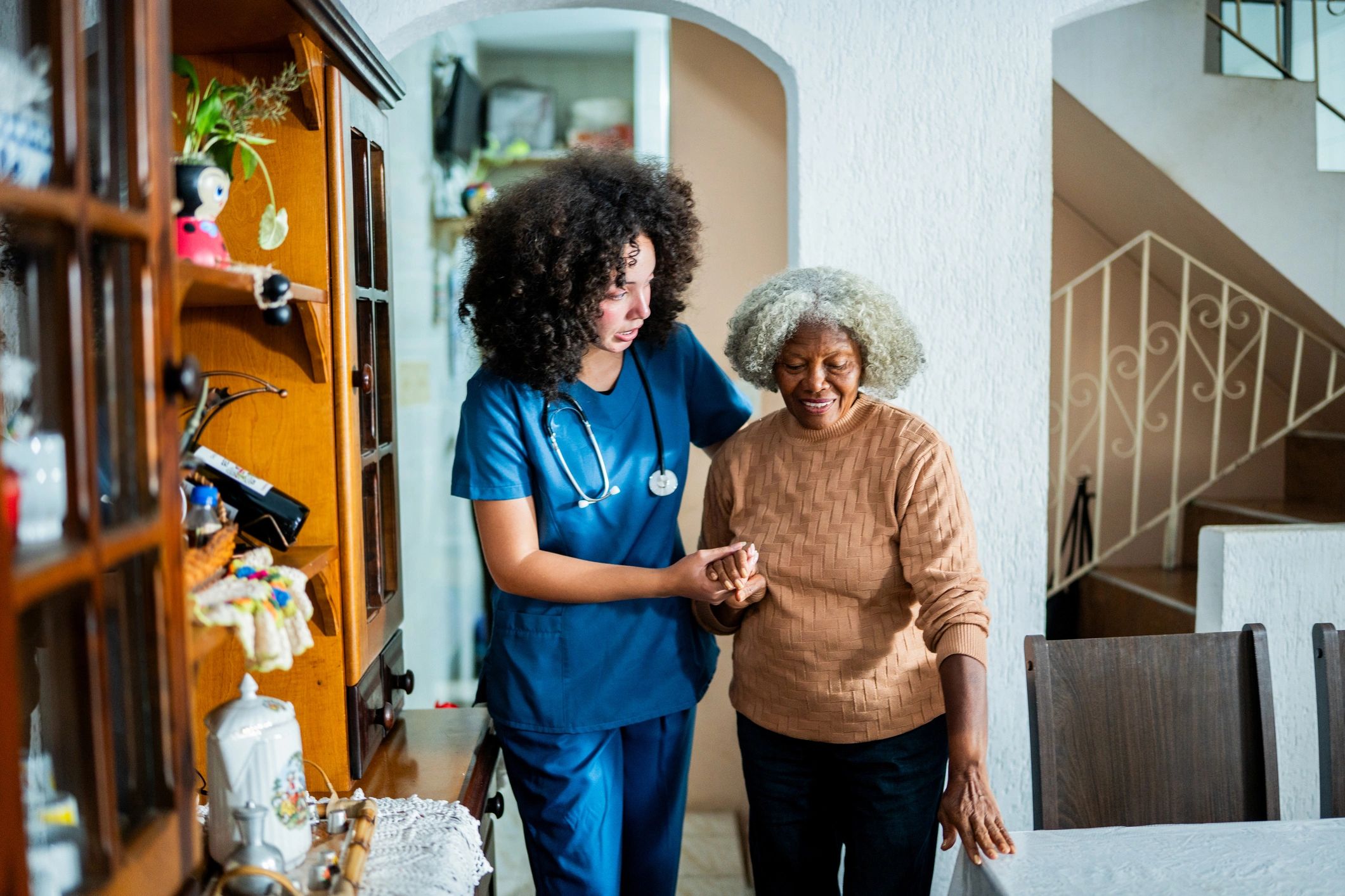 Caregiver assisting a client with mobility