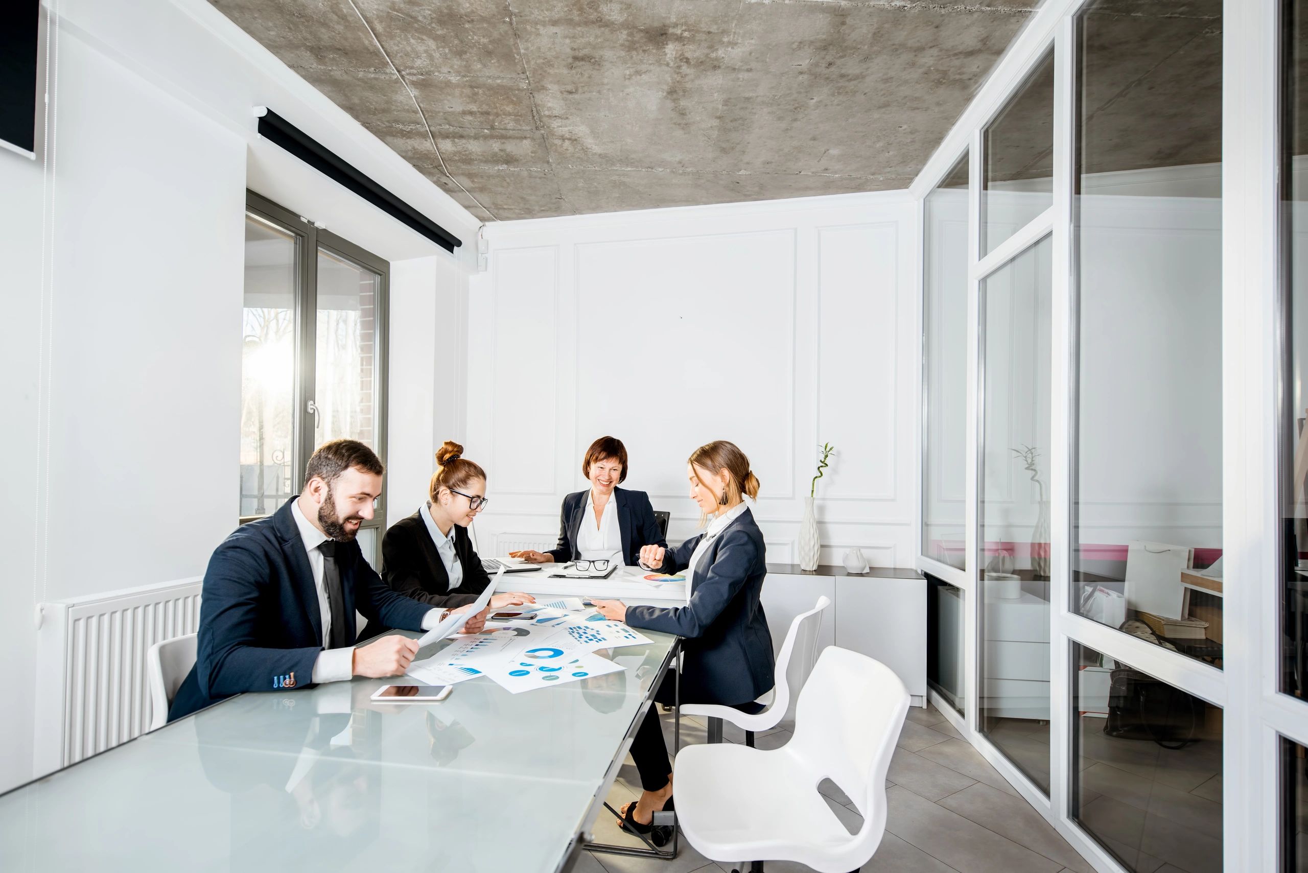 Business professionals reviewing financial documents in a modern office